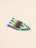Colorful beaded phone case on a beige background