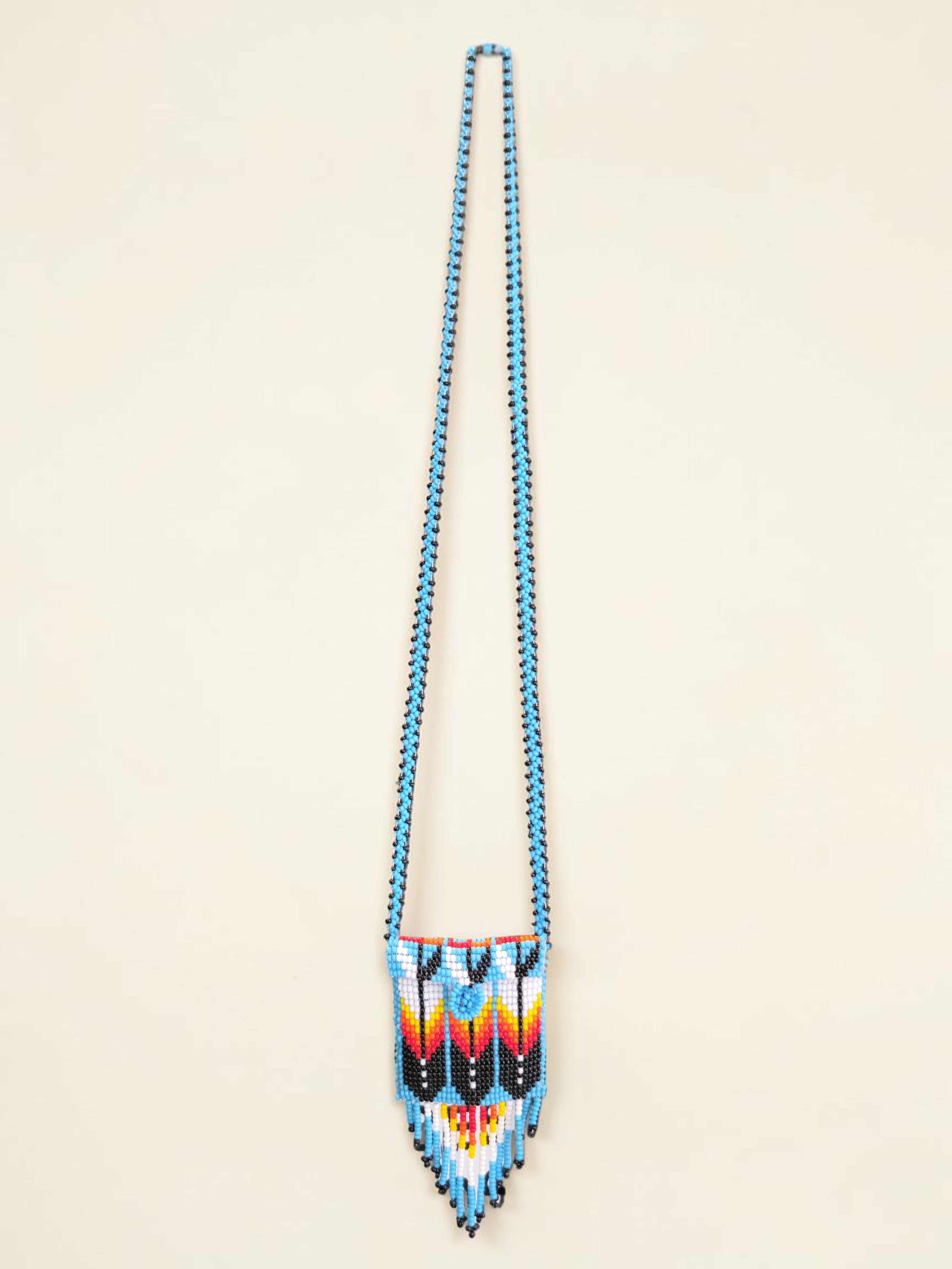 Beaded necklace with a colorful pattern on a beige background
