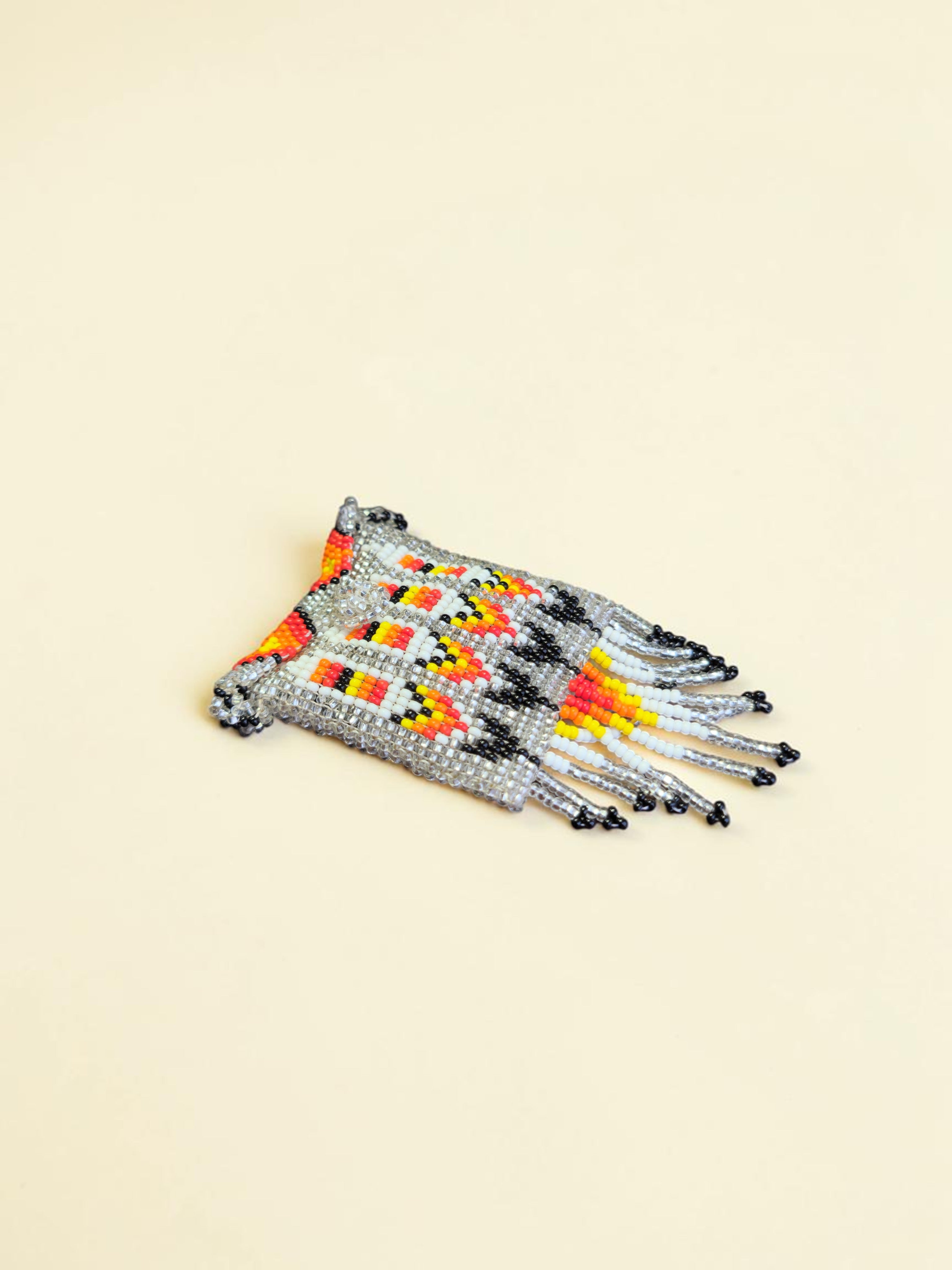 Set of beaded bracelets on a beige background