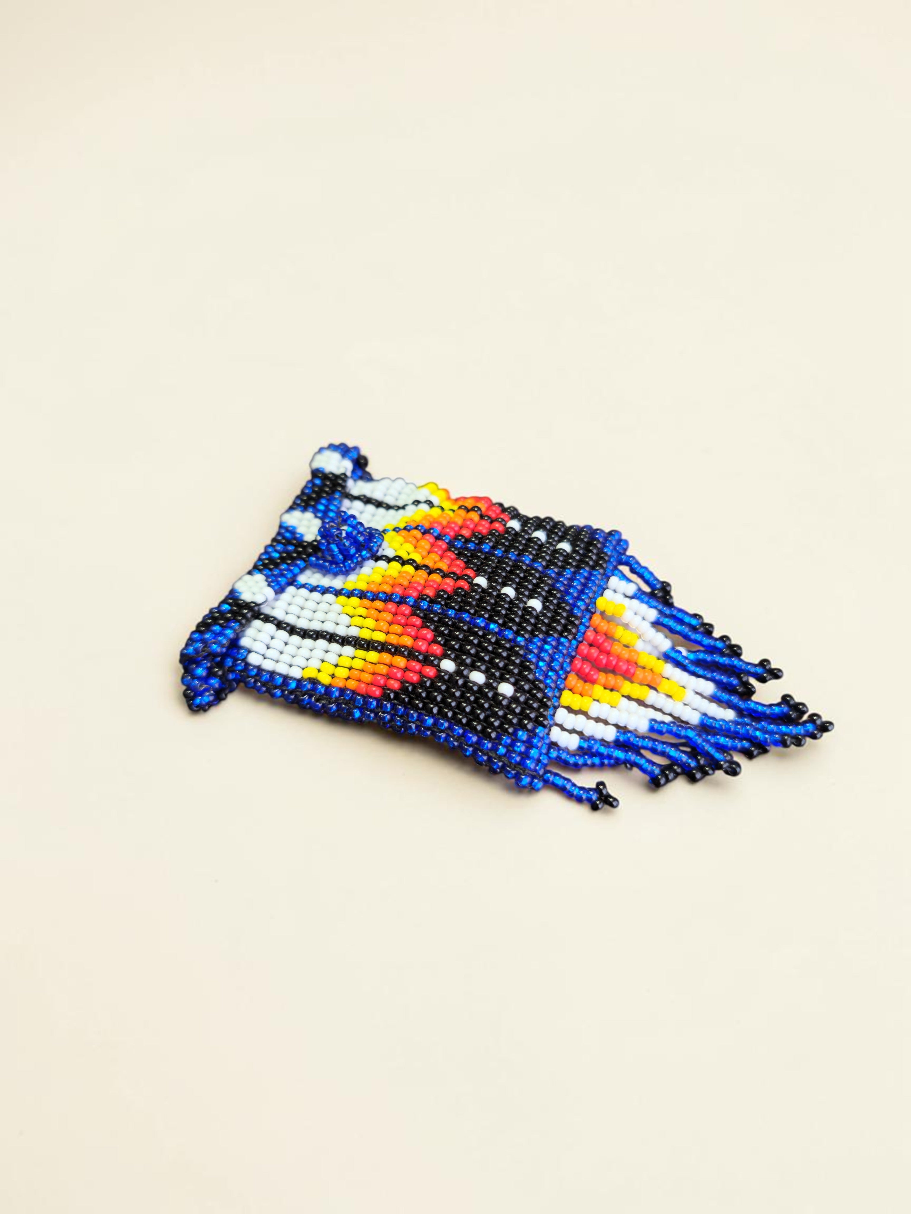 Beaded item with colorful pattern on a beige background
